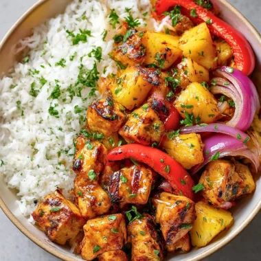 Hawaiian Chicken Sheet Pan with colorful veggies and grilled pineapple
