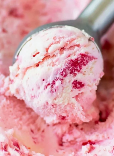 Bowl of creamy homemade ice cream with colorful toppings