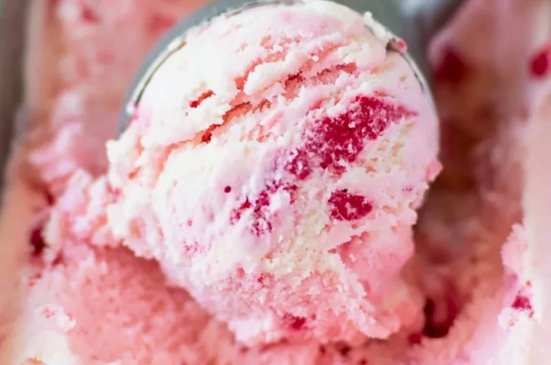 Bowl of creamy homemade ice cream with colorful toppings