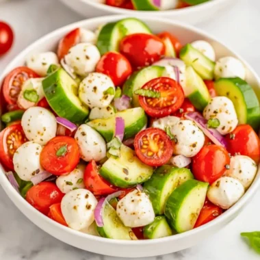 Juicy Cucumber Caprese Salad with fresh mozzarella, basil, and ripe tomatoes