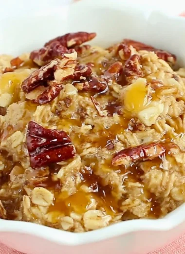 Delicious Maple Pecan Baked Oatmeal served in a bowl with pecans and maple syrup