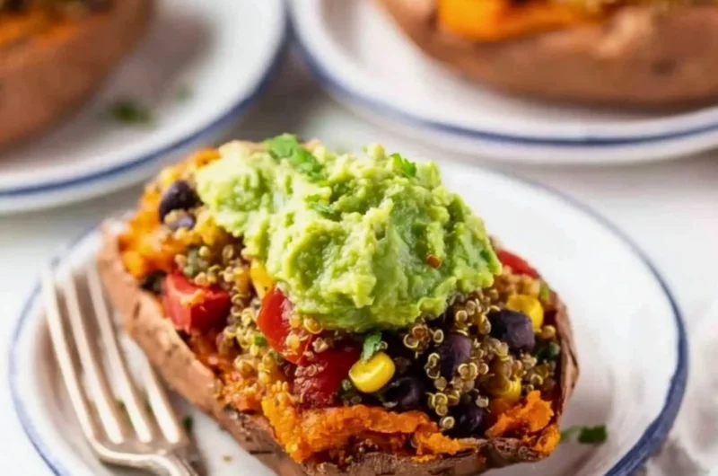 Mexican quinoa stuffed sweet potatoes topped with fresh herbs and spices