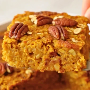 Delicious pumpkin baked oatmeal topped with nuts and spices, ready to serve.