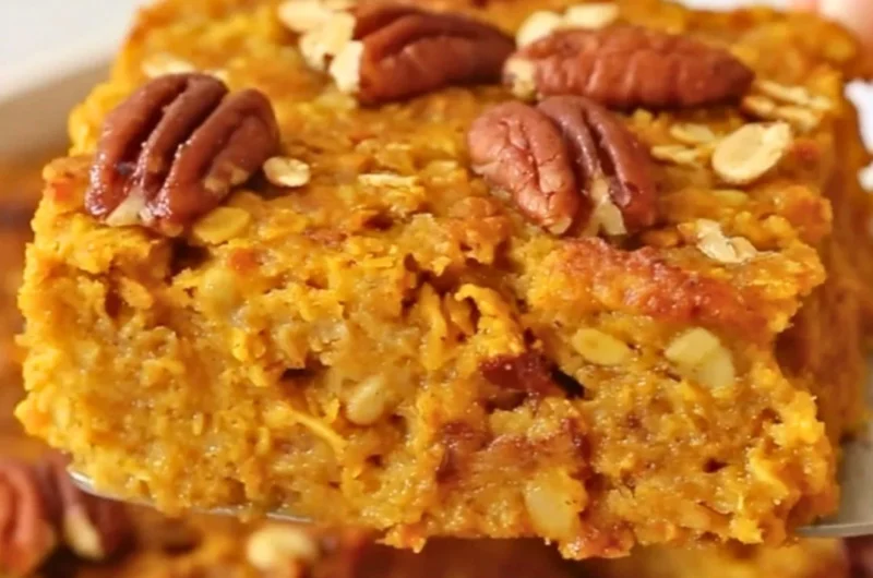 Delicious pumpkin baked oatmeal topped with nuts and spices, ready to serve.