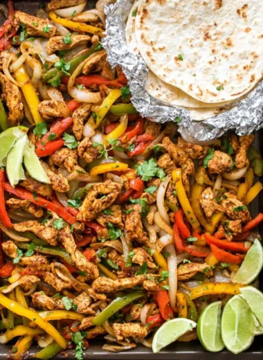 Delicious sheet pan chicken fajitas with colorful peppers and onions.