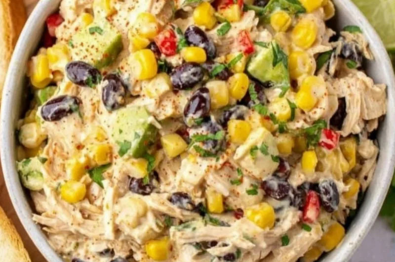 A colorful Southwest Chicken Salad with grilled chicken, avocado, and vegetables.