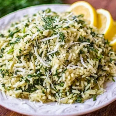 Bowl of spinach rice with fresh spinach and rice grains