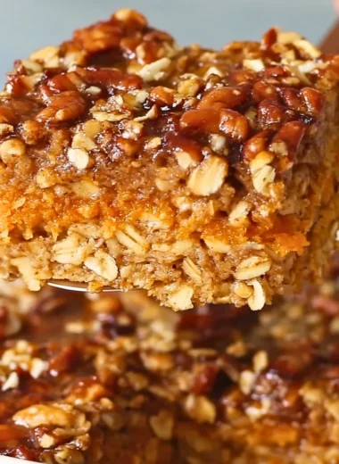 Delicious Sweet Potato Baked Oatmeal in a serving dish topped with nuts and fruits