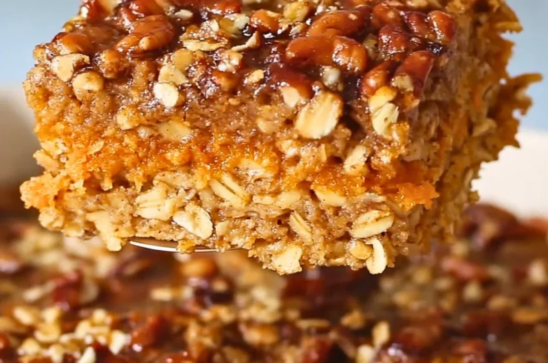 Delicious Sweet Potato Baked Oatmeal in a serving dish topped with nuts and fruits