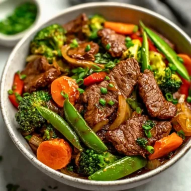 Beef stir fry with colorful vegetables in a skillet