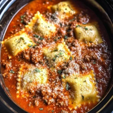 Delicious Crockpot Ravioli Lasagna layered with cheese and sauce