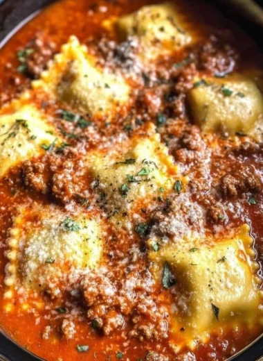 Delicious Crockpot Ravioli Lasagna layered with cheese and sauce