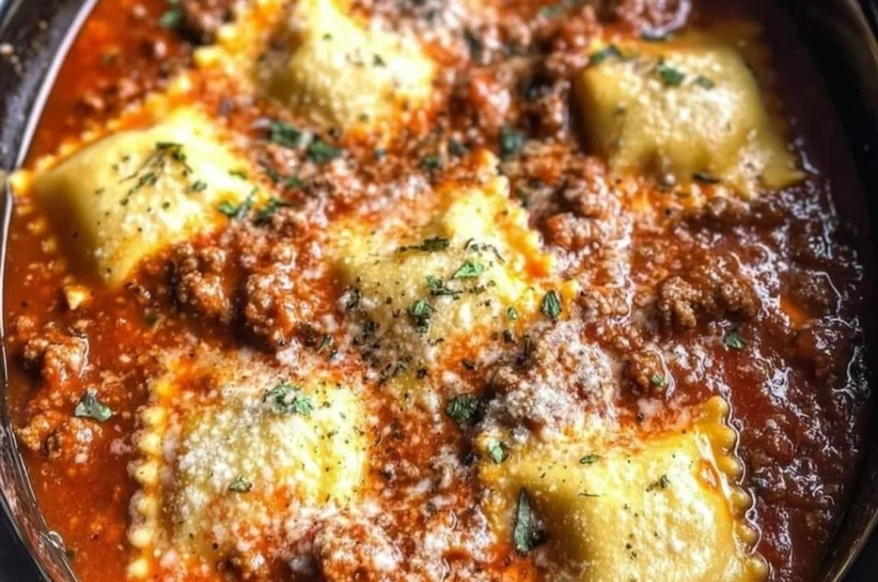 Delicious Crockpot Ravioli Lasagna layered with cheese and sauce