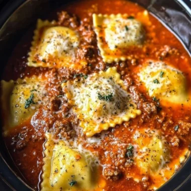 Crockpot Ravioli Lasagna in a slow cooker with layers of pasta and cheese