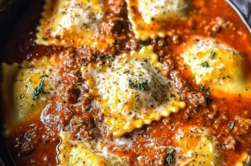 Crockpot Ravioli Lasagna in a slow cooker with layers of pasta and cheese
