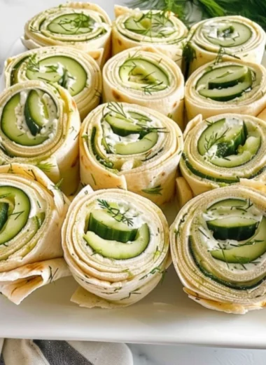 Delicious Cucumber Dill Pinwheels served on a platter as a fresh appetizer.