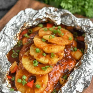 Foil Packet Hawaiian BBQ Chicken served with fresh vegetables and barbecue sauce
