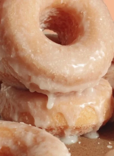 Homemade glazed donuts freshly made with a shiny, sweet glaze on top.