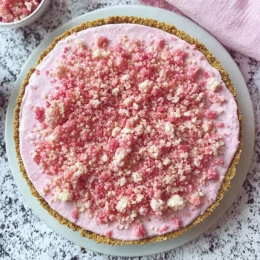 Delicious homemade strawberry ice cream pie with fresh strawberries and creamy filling.