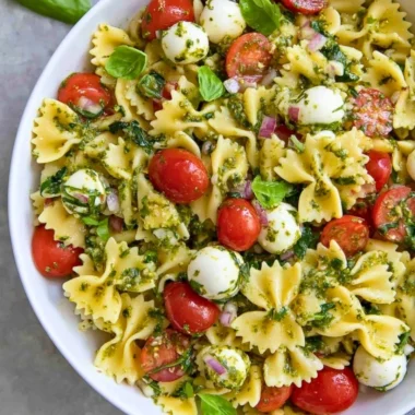 Colorful Italian Bow Tie Pasta Salad with vegetables and dressing