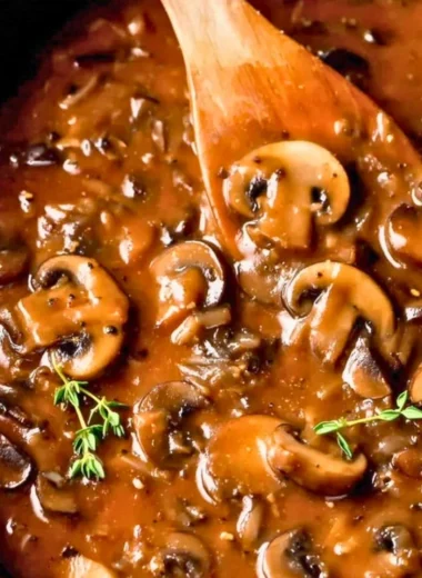 Delicious homemade mushroom gravy served over mashed potatoes