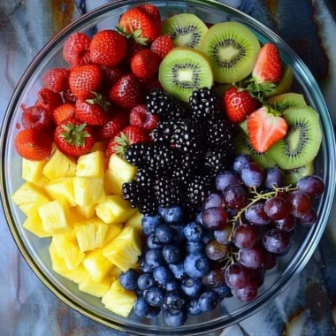 Colorful fruit salad with a variety of fresh fruits in a bowl