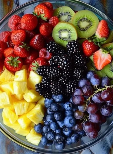 Colorful fruit salad with a variety of fresh fruits in a bowl