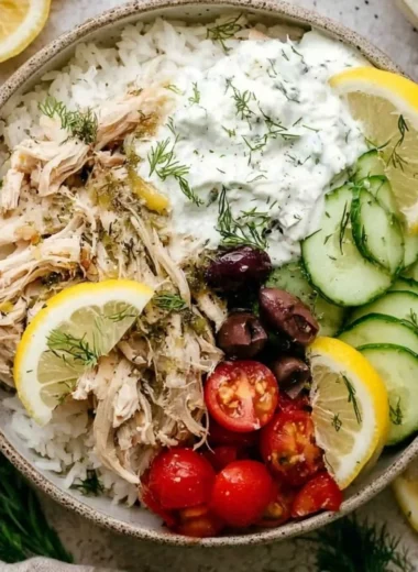 Delicious Slow Cooker Greek Chicken garnished with herbs and olives