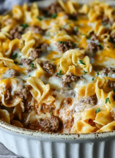 Sour cream beef noodle casserole served in a baking dish