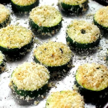 Baked garlic Parmesan zucchini chips on a plate, healthy snack option