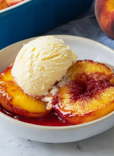Deliciously baked peaches topped with cinnamon and served warm.