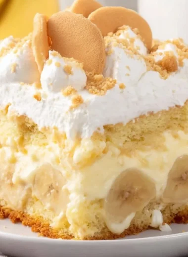 Delicious banana pudding cake layered with creamy banana pudding and whipped cream