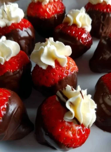 Delicious chocolate covered cheesecake strawberries on a plate