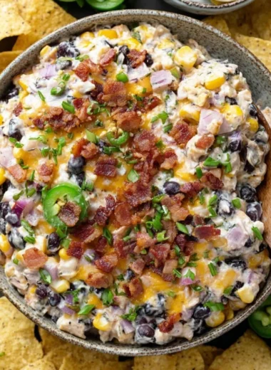 Delicious Cowboy Corn Dip served in a bowl with chips.