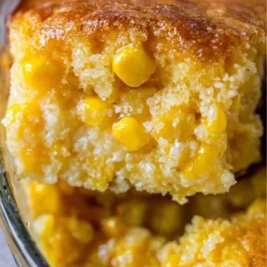 Delicious creamed corn casserole topped with golden brown corn and cheese.