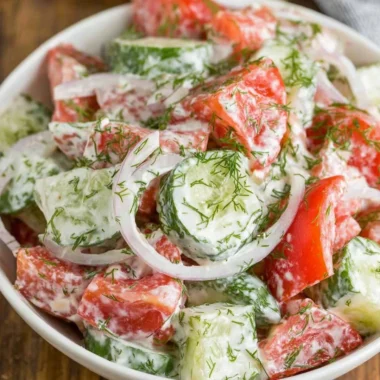 Creamy cucumber tomato salad in a bowl with vibrant colors and fresh ingredients