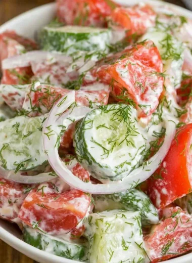 Creamy cucumber tomato salad in a bowl with vibrant colors and fresh ingredients