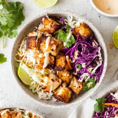 Colorful fish taco bowls filled with fresh ingredients and toppings