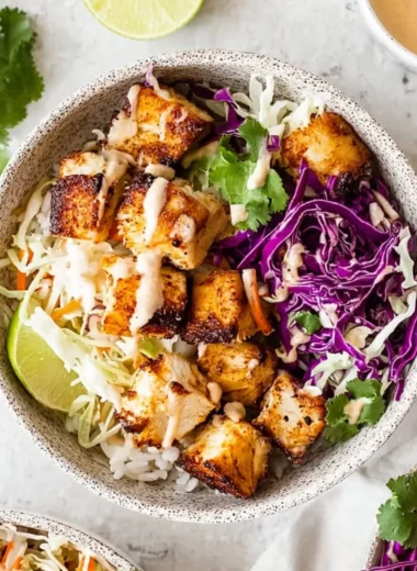 Colorful fish taco bowls filled with fresh ingredients and toppings