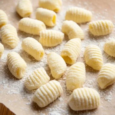 Freshly made gnocchi served with a rich sauce and herbs