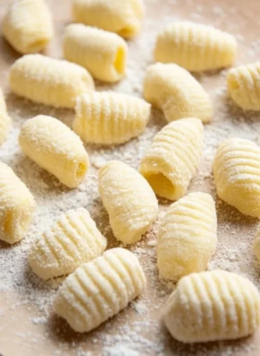 Freshly made gnocchi served with a rich sauce and herbs
