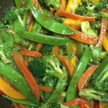 Colorful bowl of Ginger Veggie Stir-Fry with assorted vegetables and ginger