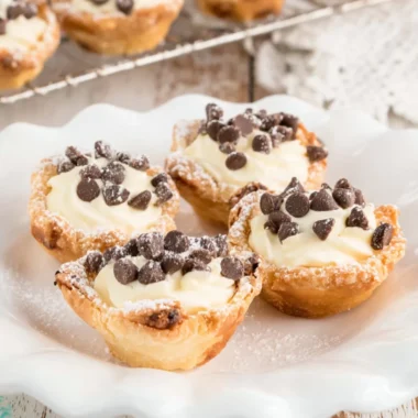 Delicious mini cannoli cups filled with creamy ricotta and topped with chocolate chips