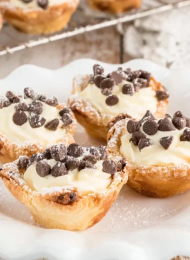 Delicious mini cannoli cups filled with creamy ricotta and topped with chocolate chips
