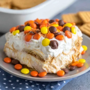 No Bake Peanut Butter Icebox Cake topped with chocolate and peanuts