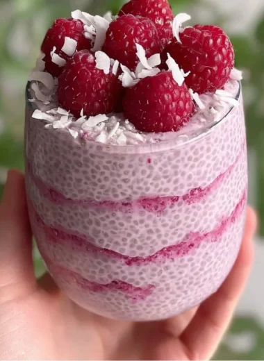 Delicious Raspberry Chia Pudding topped with fresh raspberries and mint.