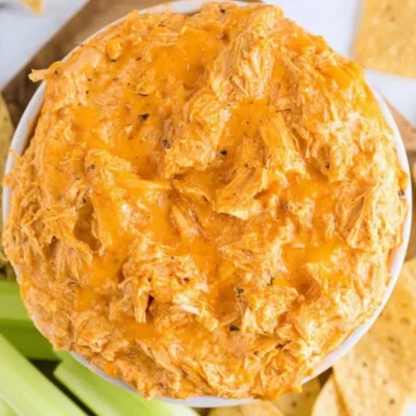 Creamy Slow Cooker Buffalo Chicken Dip served in a bowl with tortilla chips