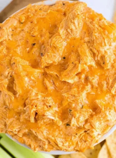 Creamy Slow Cooker Buffalo Chicken Dip served in a bowl with tortilla chips