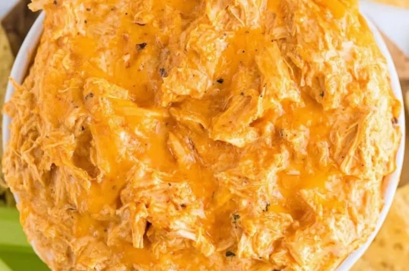 Creamy Slow Cooker Buffalo Chicken Dip served in a bowl with tortilla chips