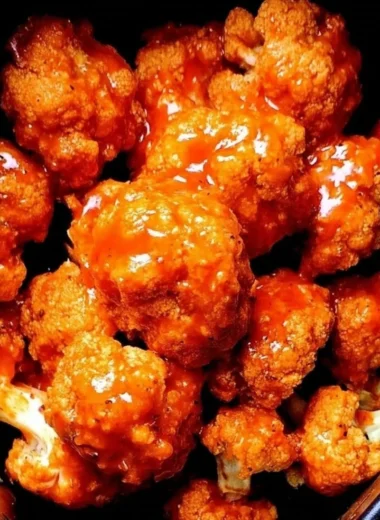Spicy air fryer Buffalo cauliflower bites served with dipping sauce